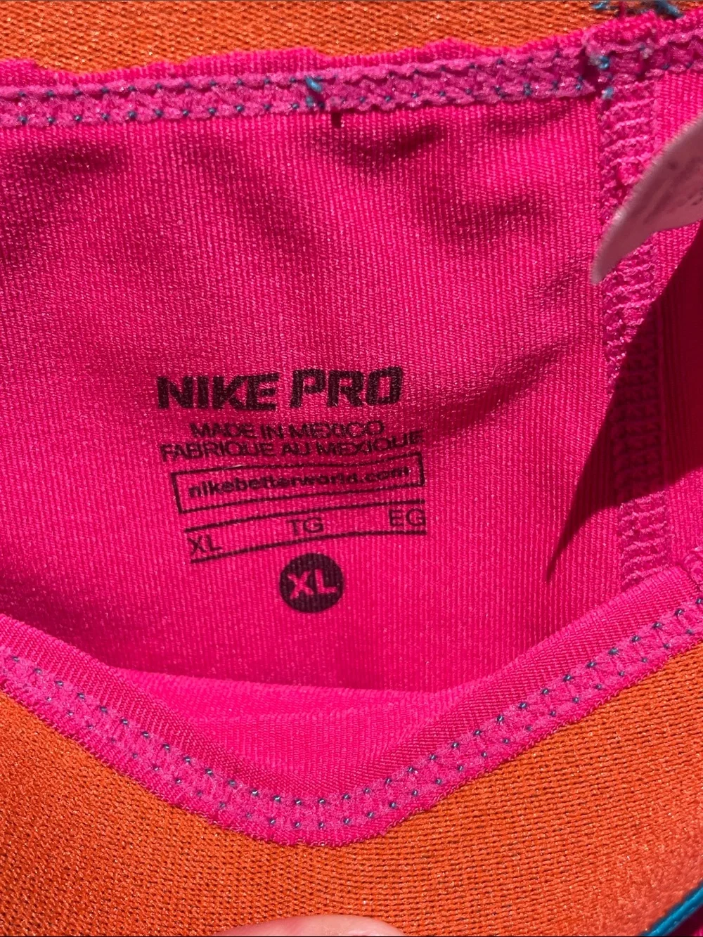 Nike Pro Women's Hot Pink Athletic Shorts with Teal Waistband